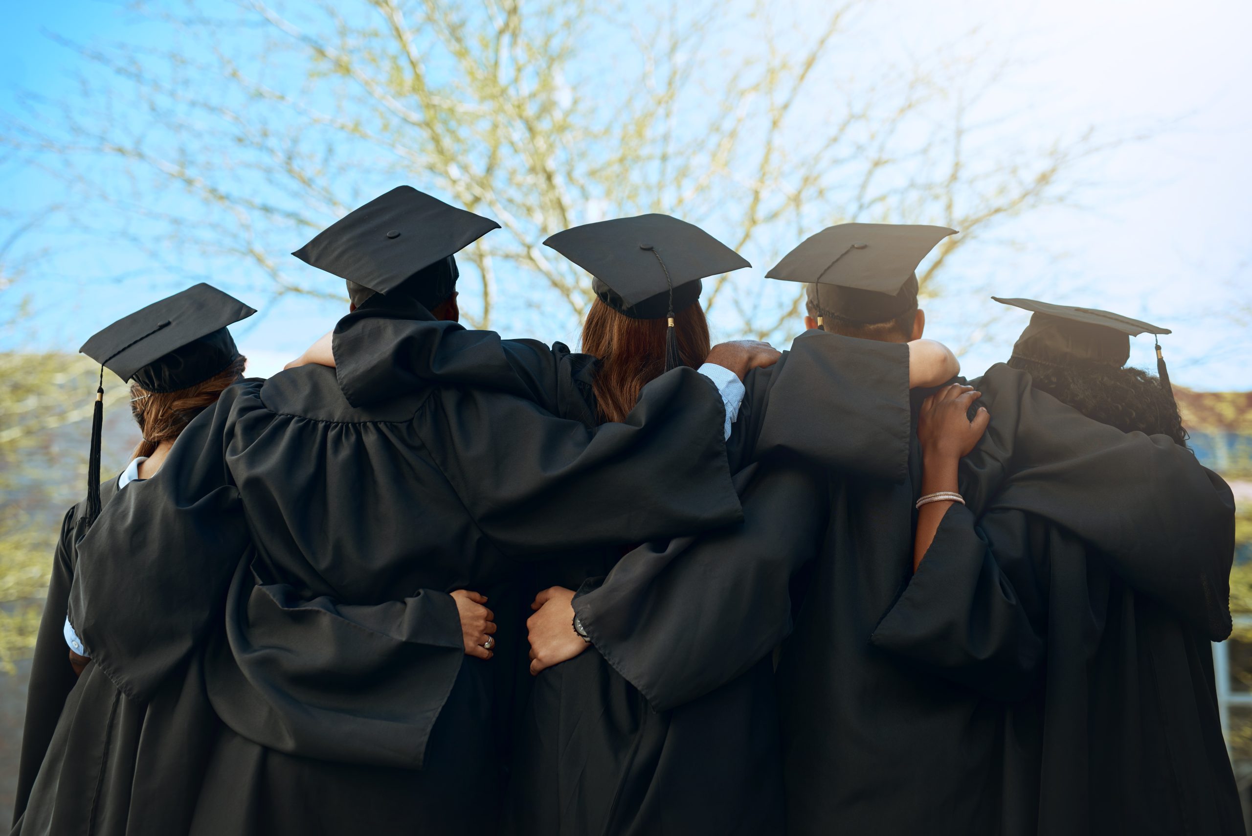 Embrace, group of graduates and together with joy on graduation day or celebrating academic achievement and outdoors. Certification, young students and hug outside or robes or hats and education Your future’s looking bright, and we’re here to walk it with you. Whether it’s opening your first credit card, starting a savings plan, or just figuring out how to adult with money Southern Lakes is here for all of it. Need help setting things up? Come see us or give us a call. We’re proud of you, and we can’t wait to see what you do next!
